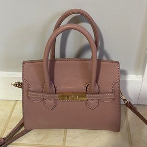 Purse, color is gold and pinkish purple comes from Marshall’s